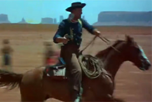 John Wayne cabalgando por el Valle de los Monumentos
